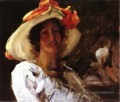 Portrait de Clara Stephens portant un chapeau avec un ruban orange William Merritt Chase